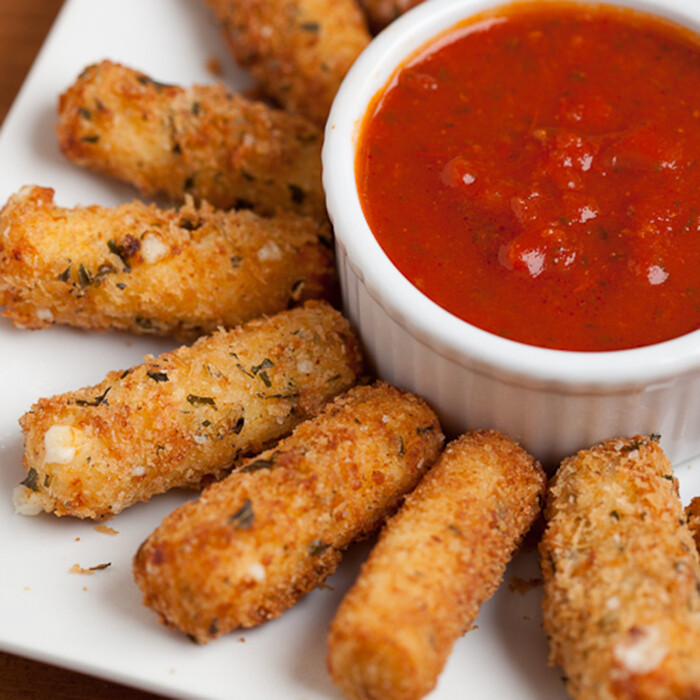 Baked Mozzarella sticks with marinara sauce Baked Mozzarella sticks with marinara sauce