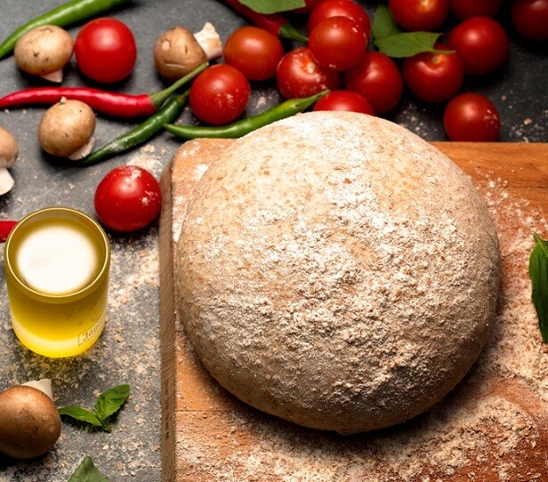 Wholewheat pizza dough عجينه البيتزه بالدقيق الاسمر Wholewheat pizza dough عجينه البيتزه بالدقيق الاسمر