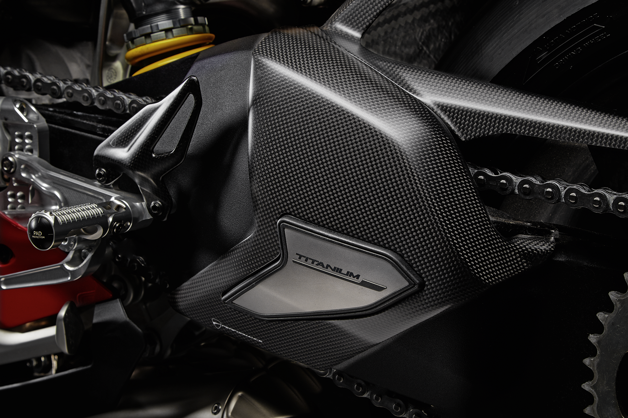Carbon and titanium swingarm guard.