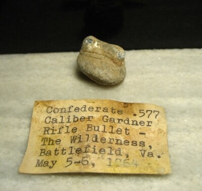 JUST ADDED ON 5/20 - THE BATTLE OF THE WILDERNESS - Fired Confederate Gardner Bullet - Partially Mushroomed - May Have Wood Attached - with Original Collection Label JUST ADDED ON 5/20 - THE BATTLE OF THE WILDERNESS - Fired Confederate Gardner Bullet - Partially Mushroomed - May Have Wood Attached - with Original Collection Label